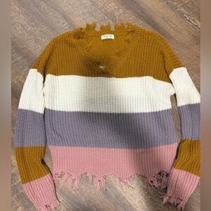 Stylish V-Neck Sweater with Fringe Hem